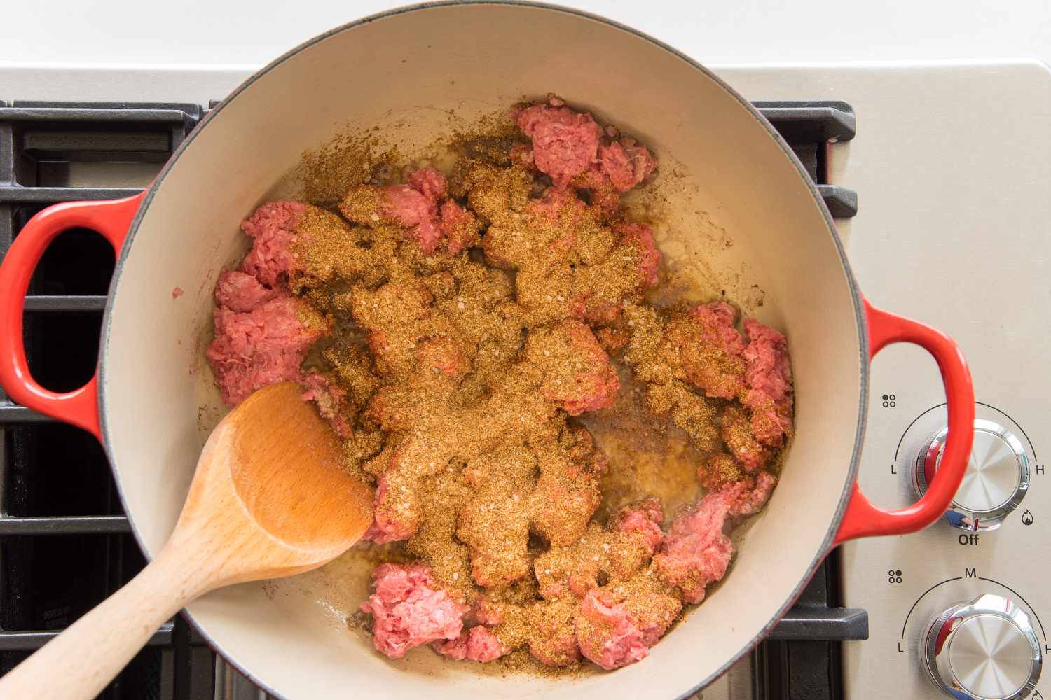 Seasoned Ground Beef Cooking in Dutch Oven for Stovetop Taco Soup Recipe