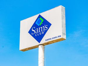 Billboard with Sams Club logo and website URL in an outdoor location