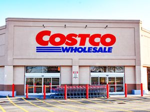 Entrance of a Costco Wholesale store with shopping carts lined up outside