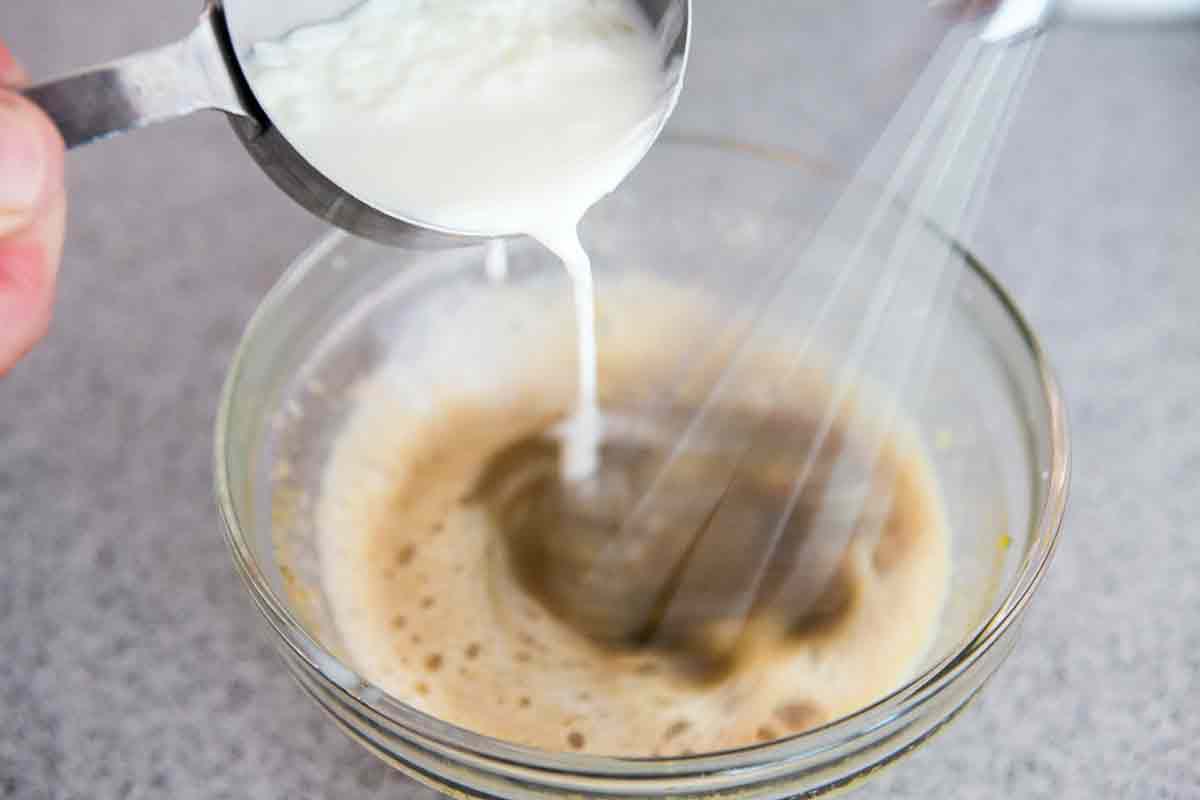 temper eggs with hot rice pudding mixture