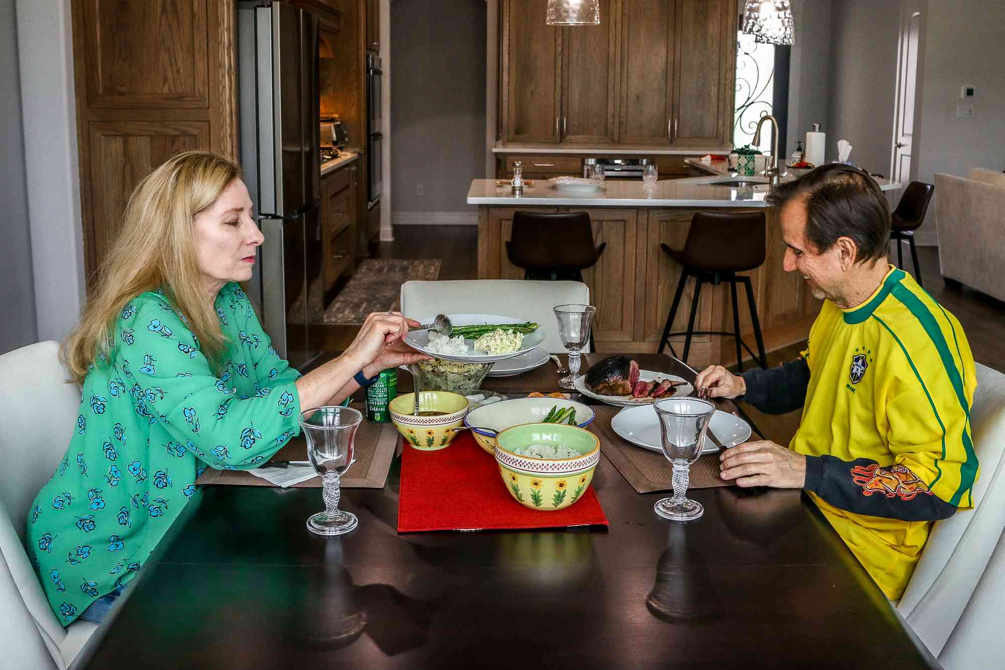 The Monteiros eat at the dining table