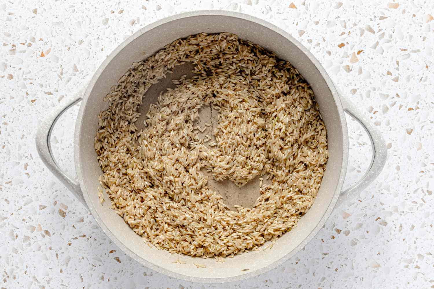 Brown Rice Toasted in a Dutch Oven for Easy Rice and Beans Freezer Burritos Recipe