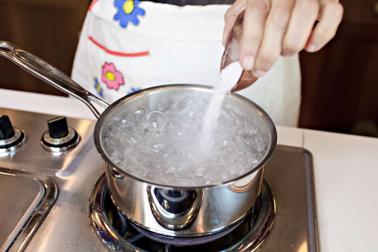 Small Dish of Salt Added to a Pot of Boiling Water for Fermented Pickles Recipe