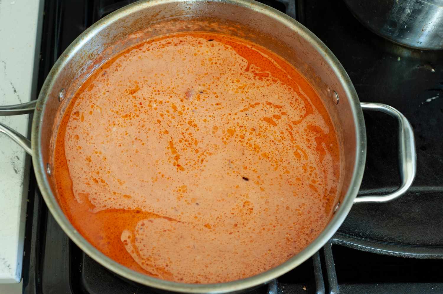 Crushed Heavy Cream Added to Skillet for Penne alla Vodka