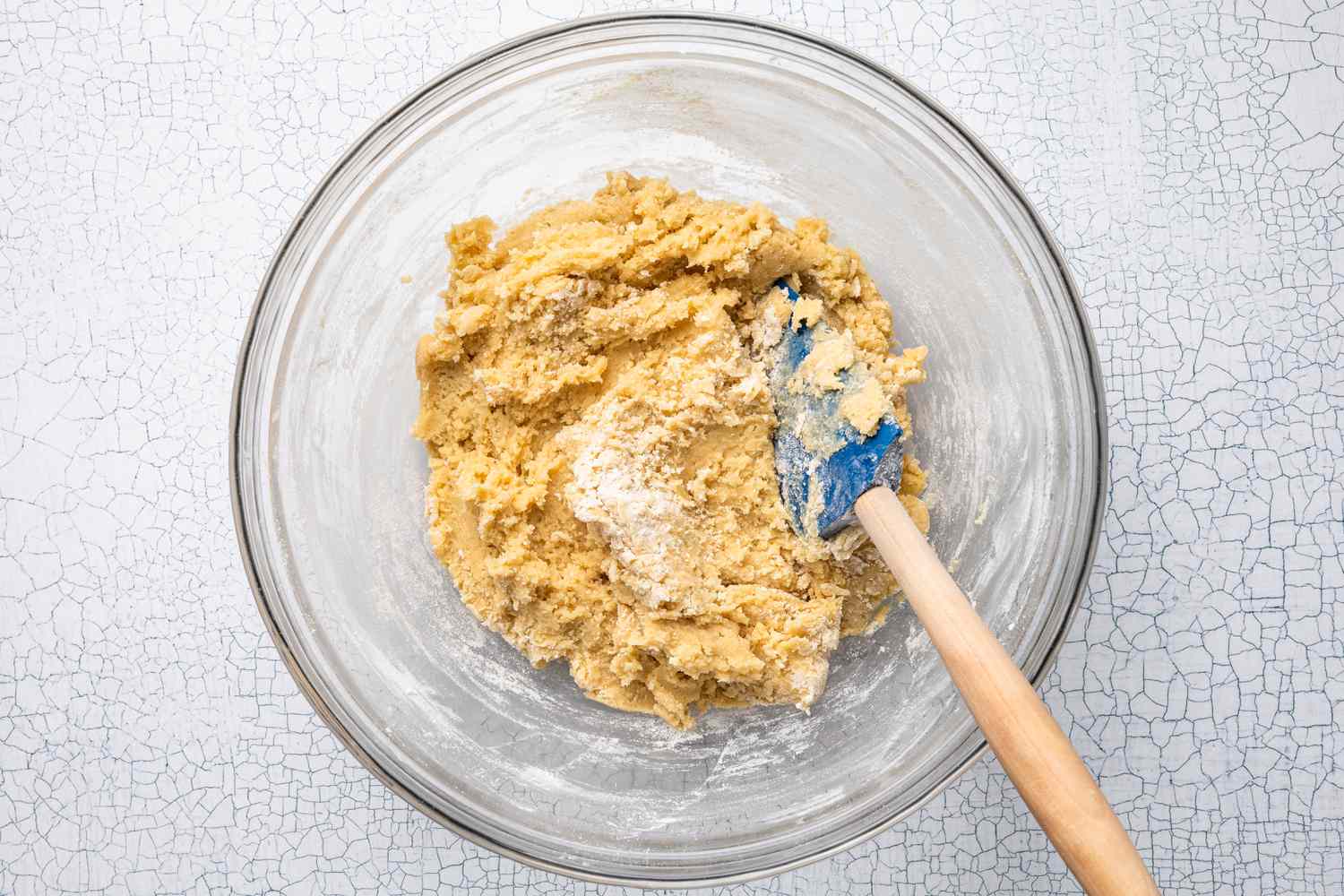 Bowl of Cookie Dough (With Some White Streaks) With a Rubber Spatula