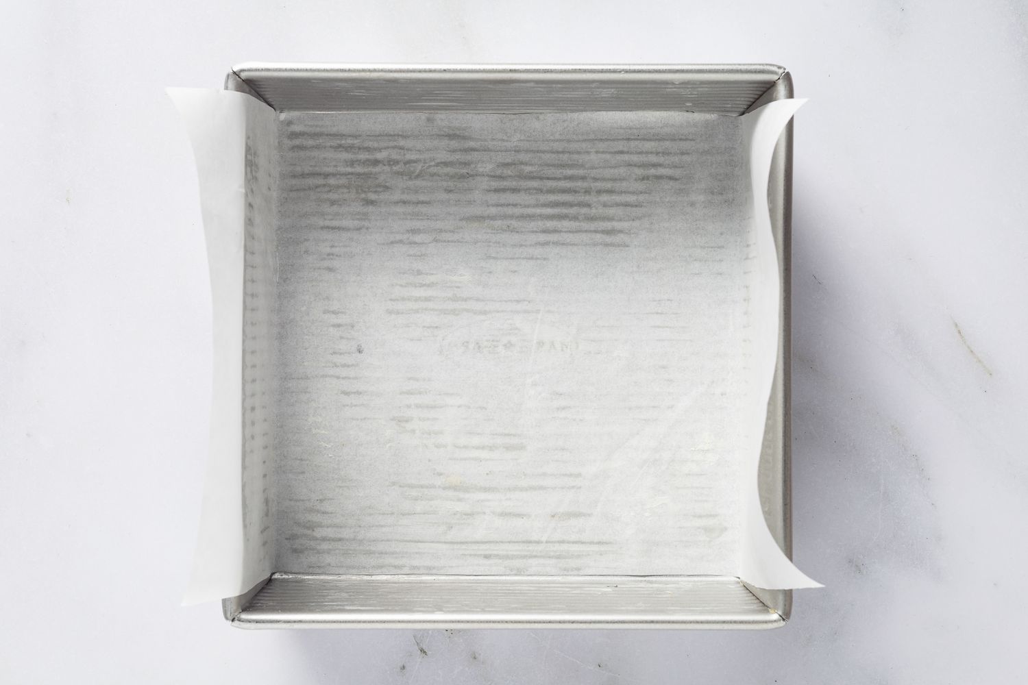 baking pan lined with parchment paper for magic cake (gÃ¢teau magique) recipe