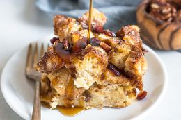 Syrup Being Poured On Square of Easy French Toast Casserole 