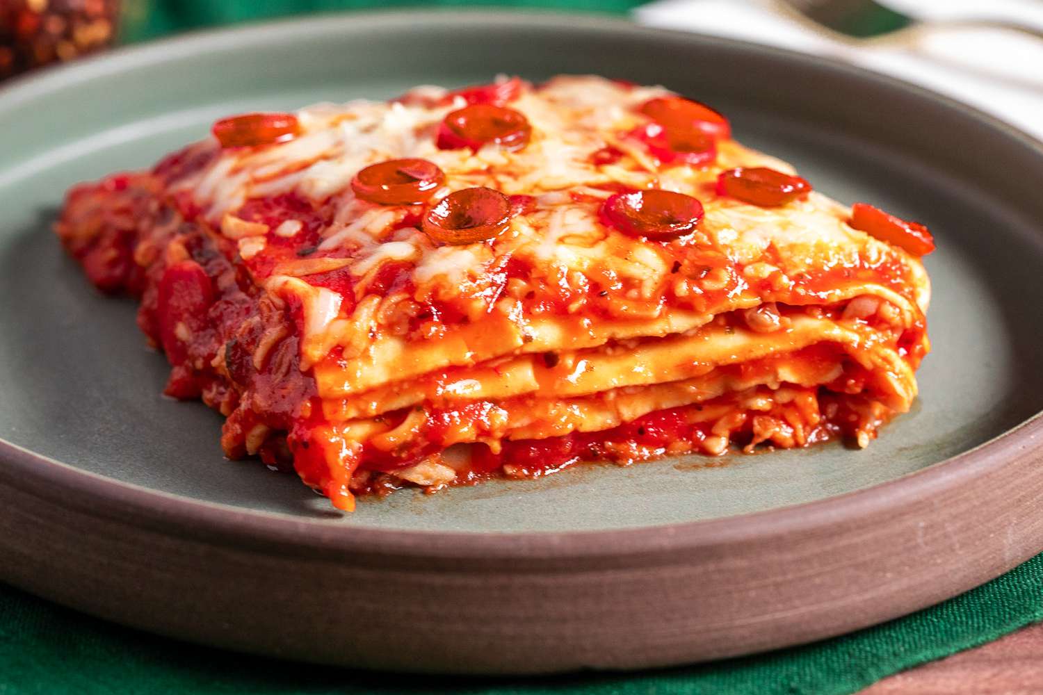 Slice of Pepperoni Pizza Lasagna on a Plate 
