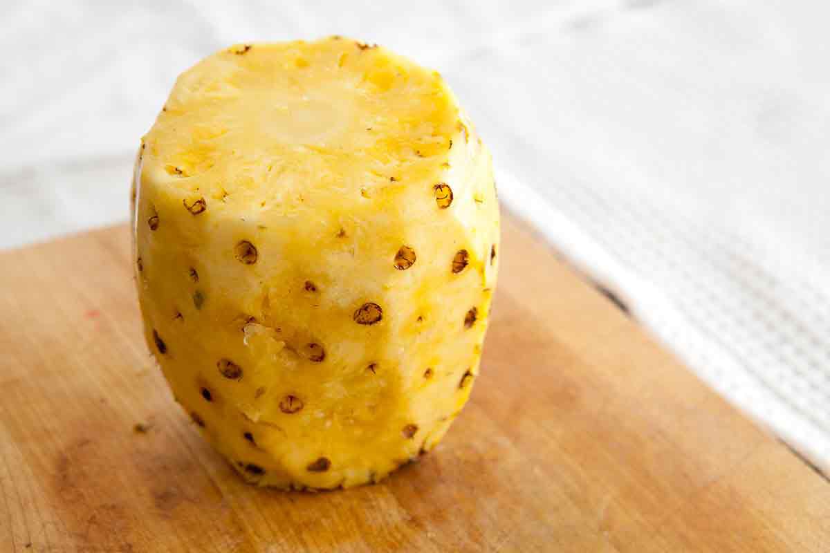 pineapple with skin cut, eyes still need to be removed