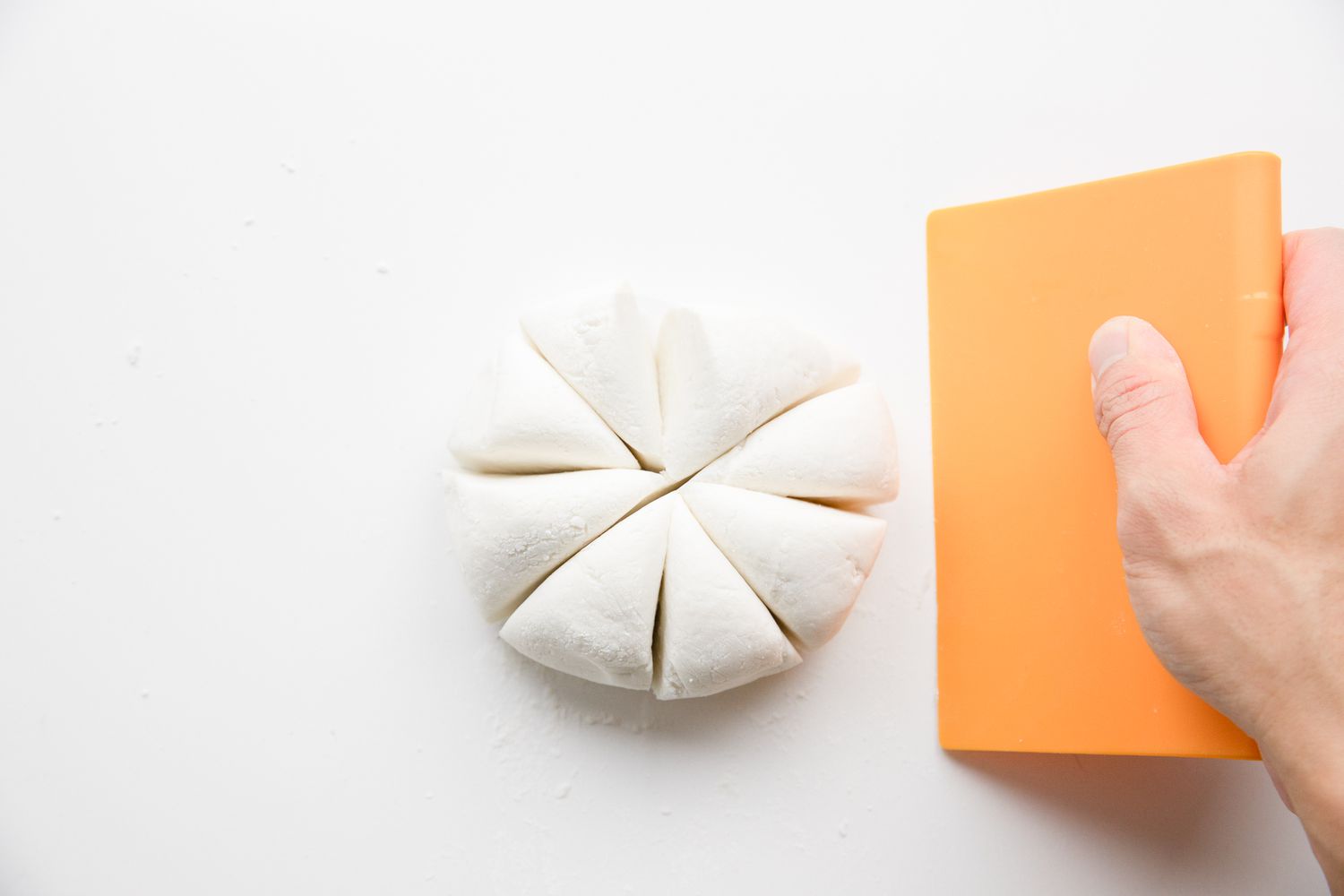 Dough Ball Cut into Eight Pieces Using a Bench Scraper
