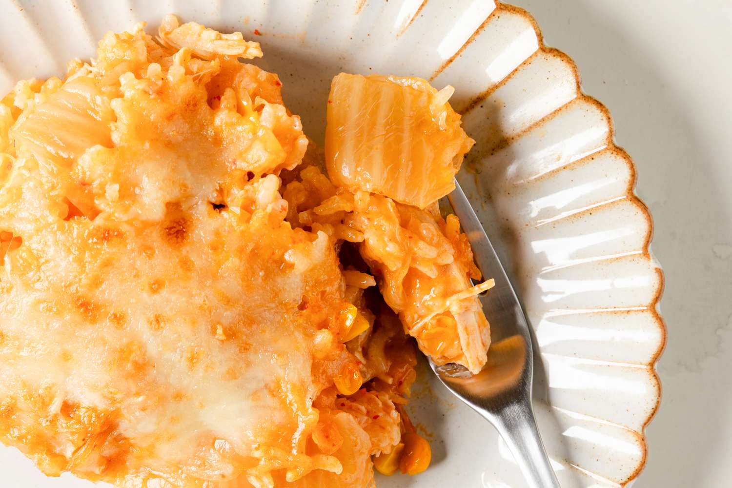 Chicken, Corn, and Tangy Cabbage Casserole on a plate with a fork