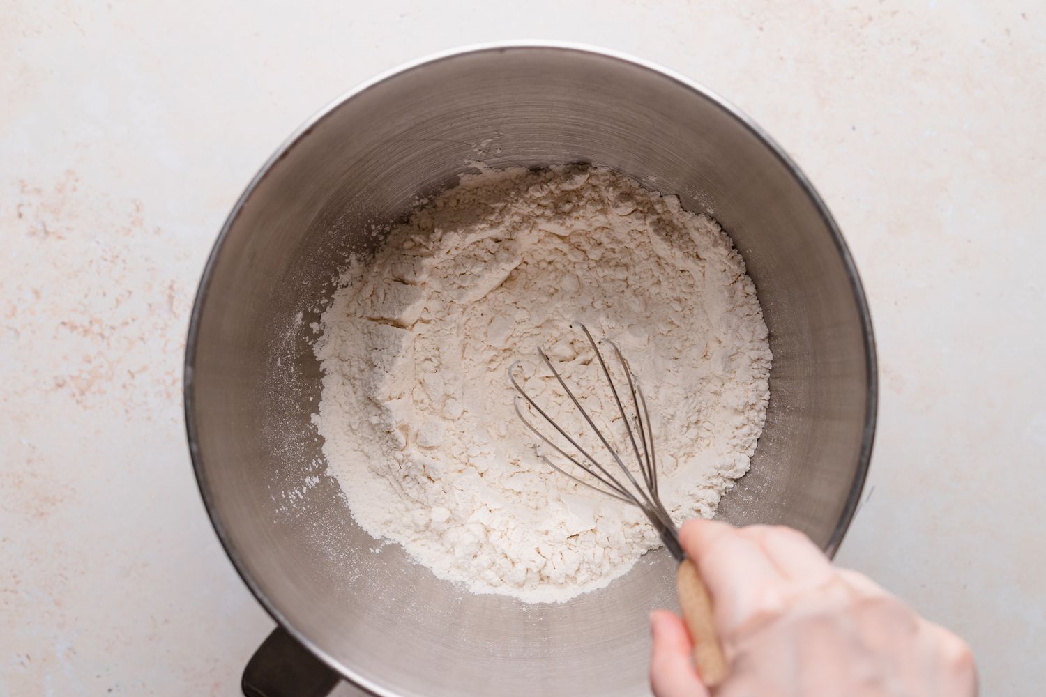 Whisking the dry ingredients to make chocolate loaf bread.