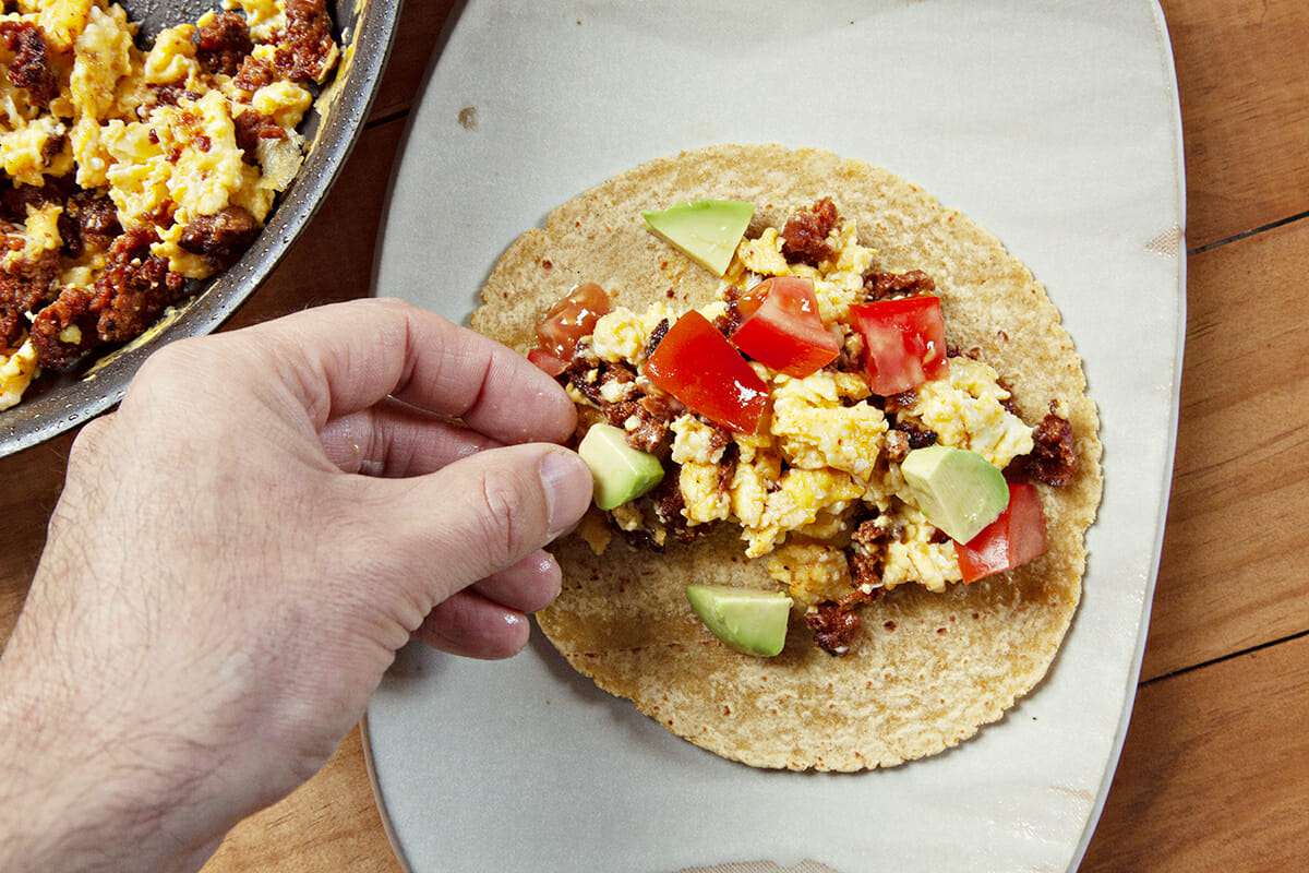 Egg Breakfast Tacos with Chorizo add the avocado and tomatoes