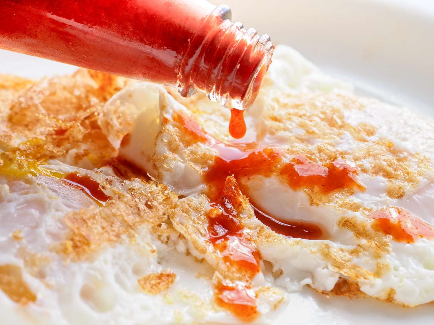 hot sauce added to fried eggs 