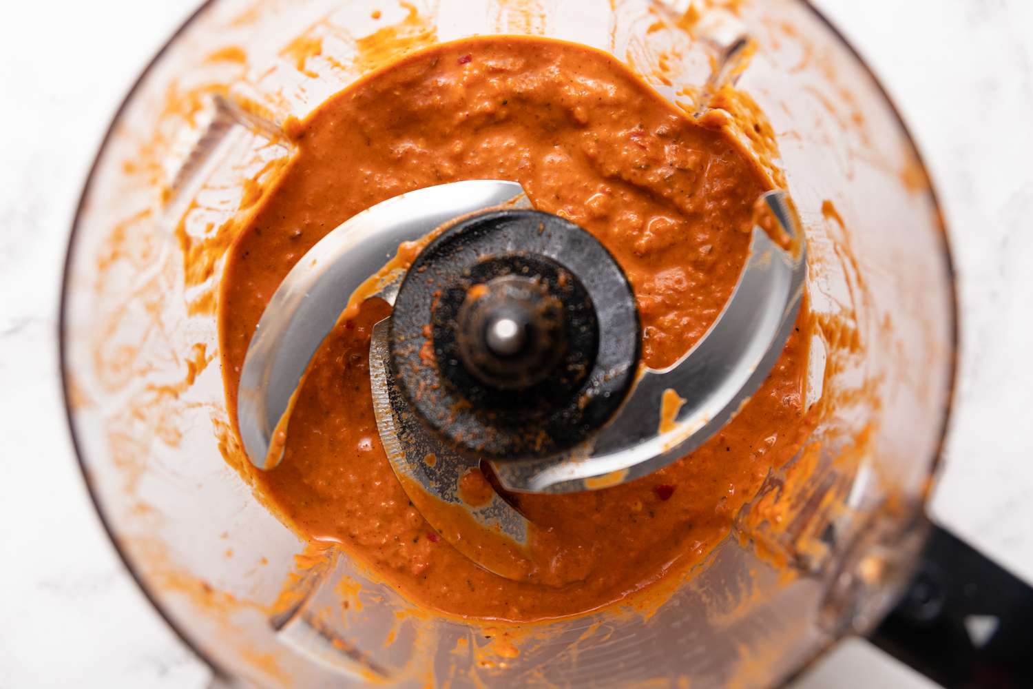 Harissa in a Food Processor for Smoked Spatchcock Chicken with Harissa Butter and Grilled Carrots