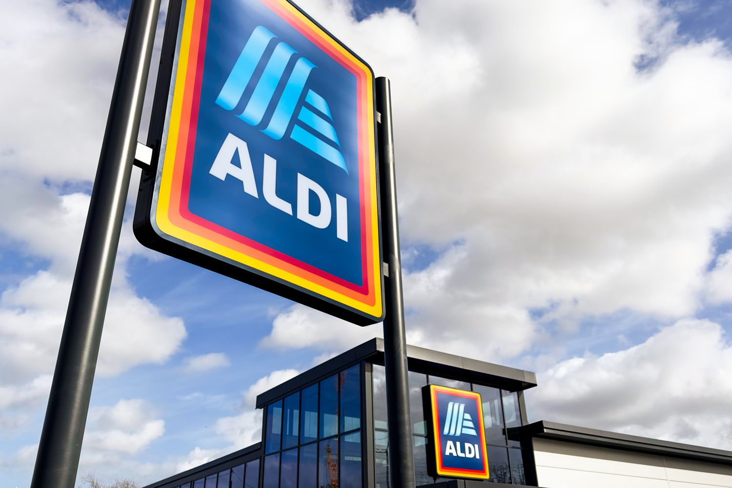 A large ALDI sign outside of a ALDI store