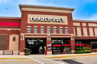 Ground level view of a Trader Joe's store front and sign