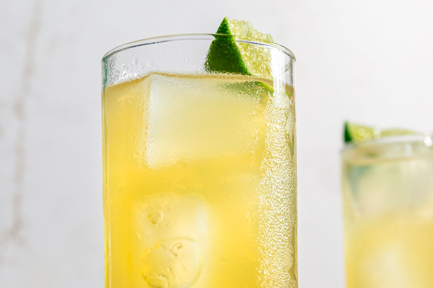 Mezcal Shandy cocktails garnished with lime slices