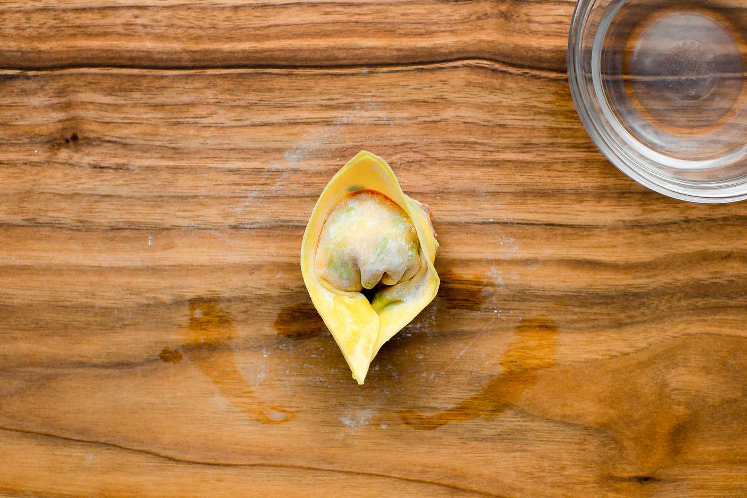 Edges Pinched Together to Form a Tael Shaped Pork and Chive Dumpling