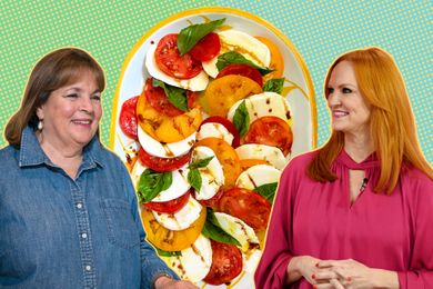 Ina Garten and Ree Drummond standing in front of a plate of sliced tomatoes and mozzarella cheese garnished with basil