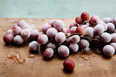 Frozen red grapes on a table