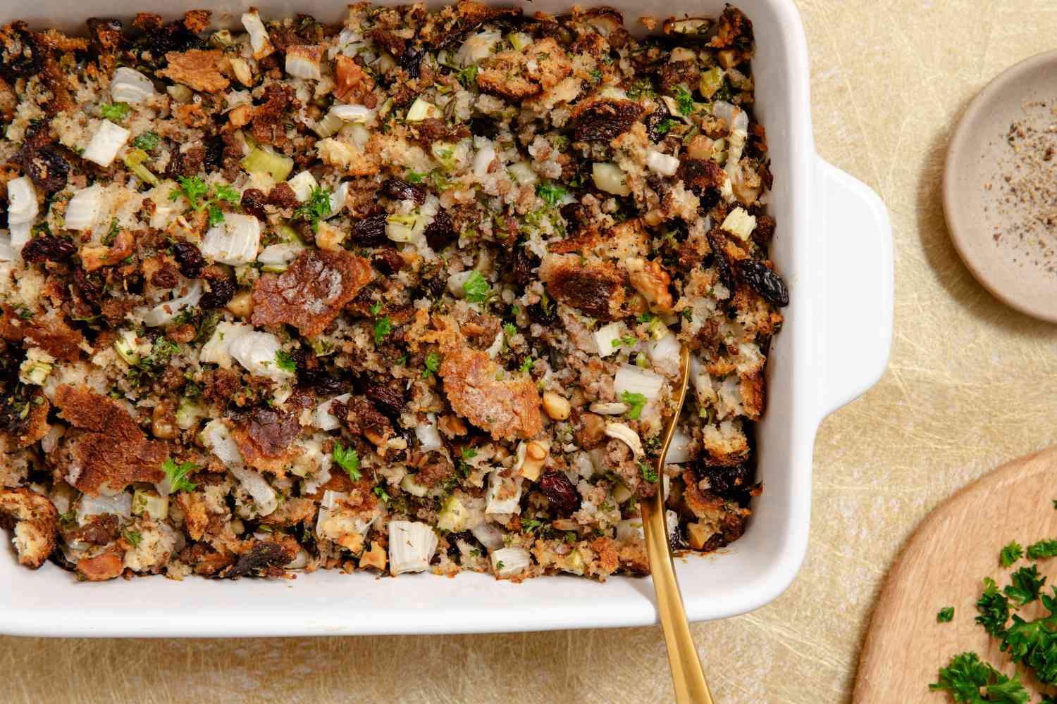 A ceramic baking dish full of stuffing