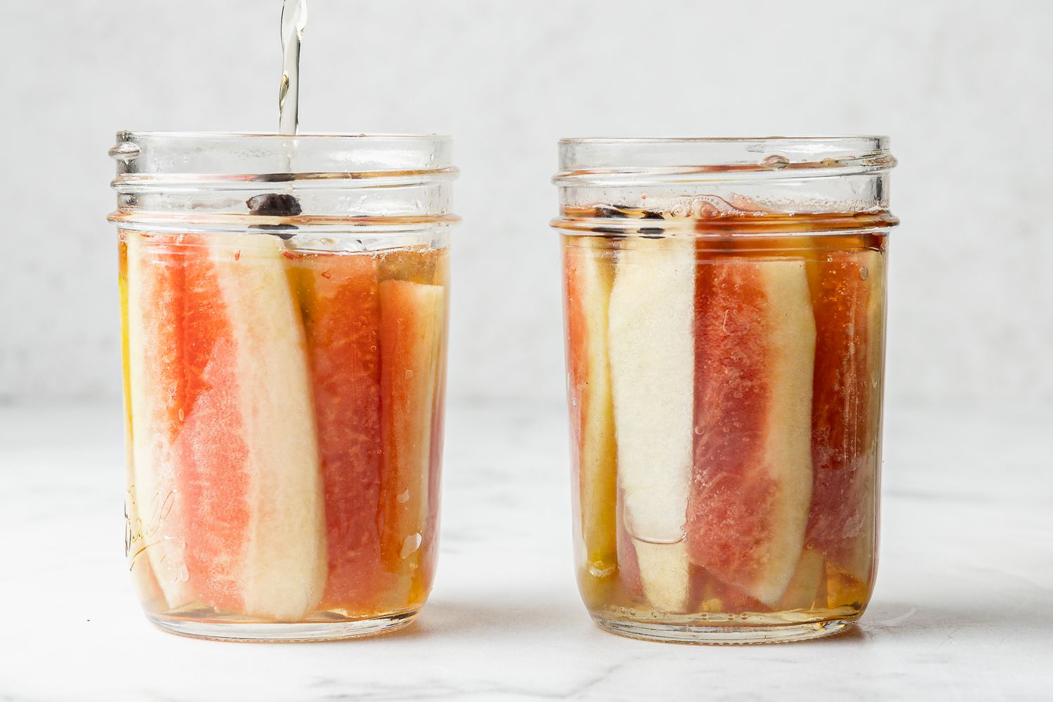 Brine Poured into Jars with Watermelon Rinds