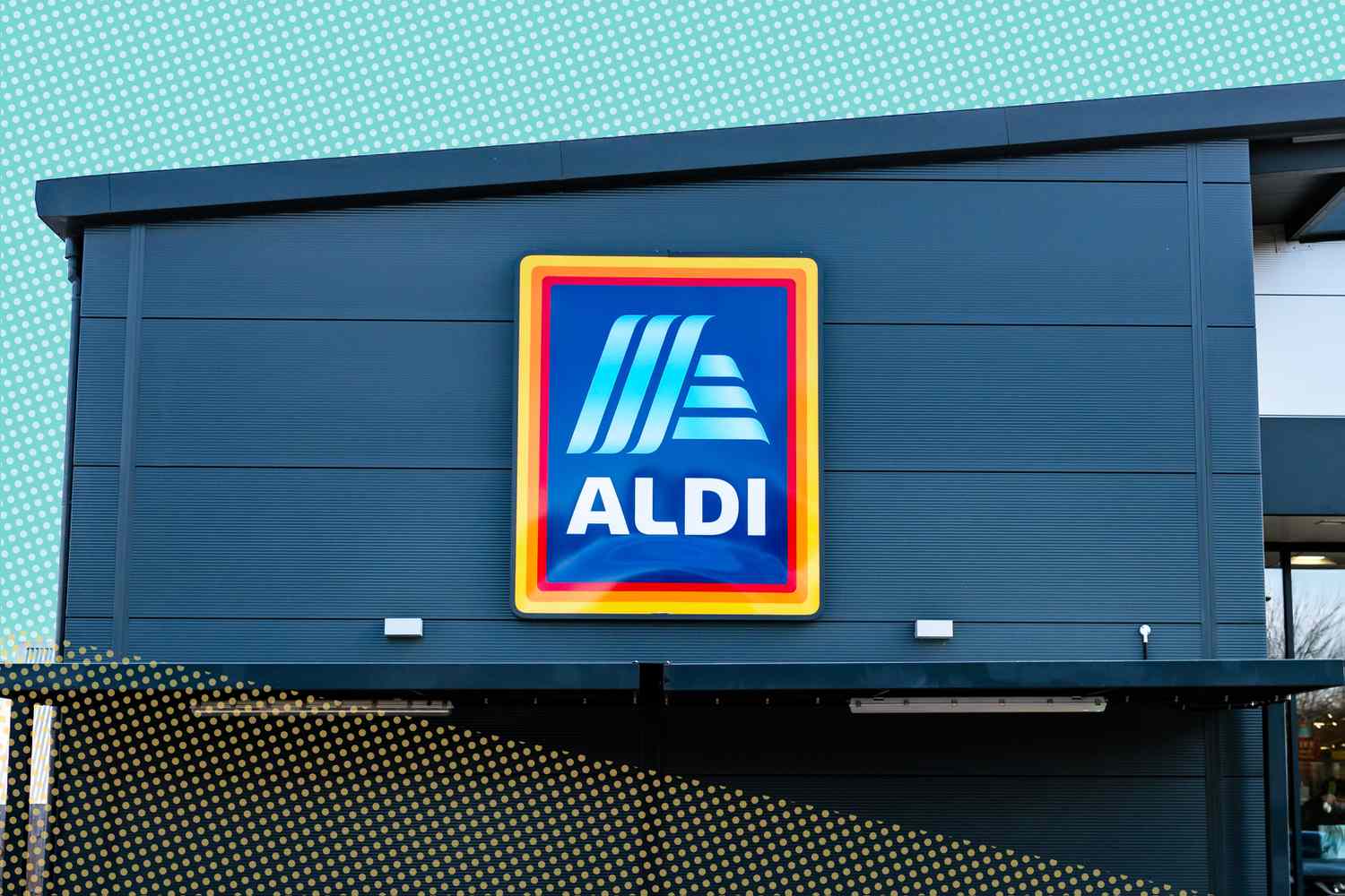 The exterior of an ALDI supermarket with the brand's logo prominently displayed on the facade