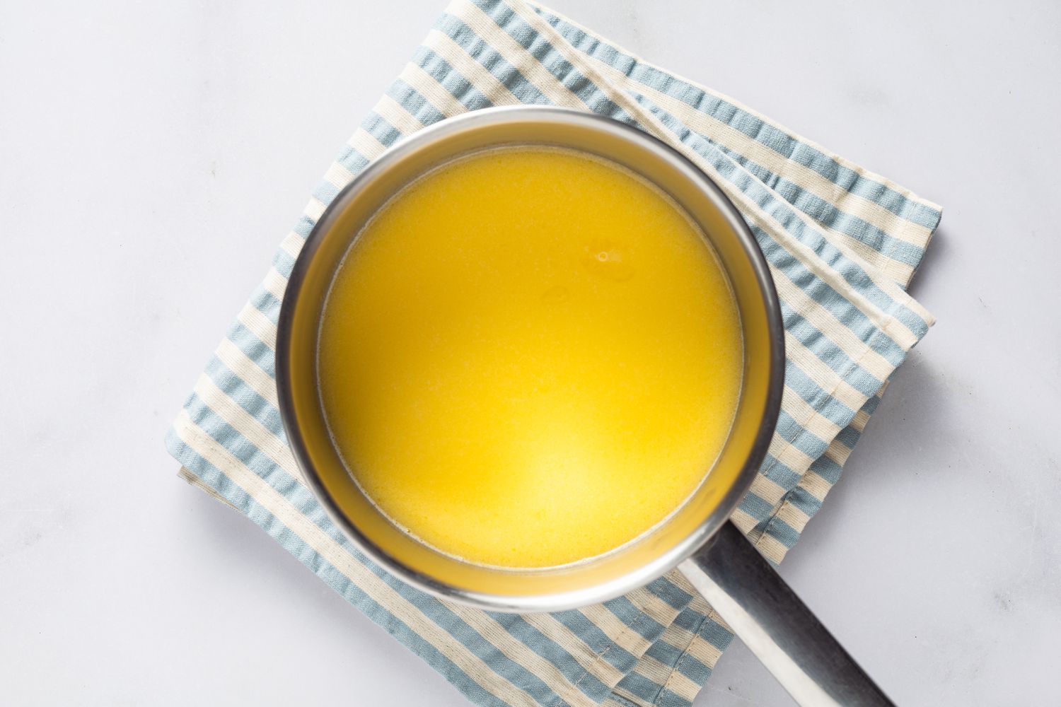 milk and melted butter in a saucepan for gÃ¢teau magique recipe