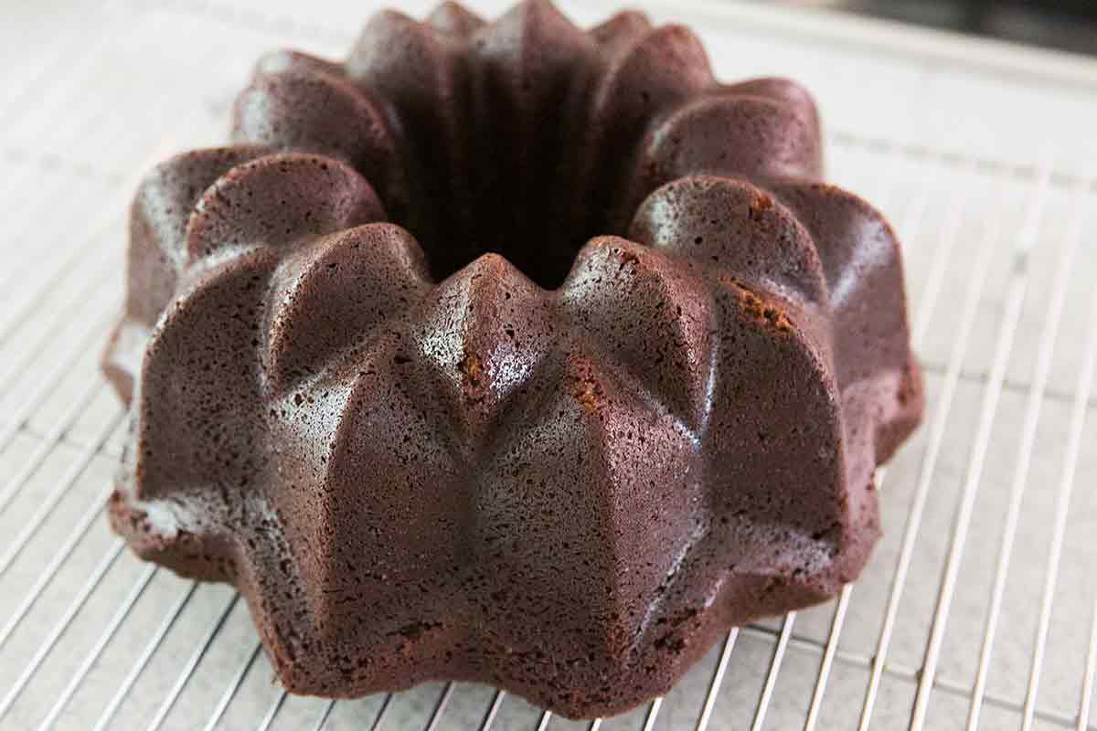 unmolded chocolate bundt cake on a cooling rack