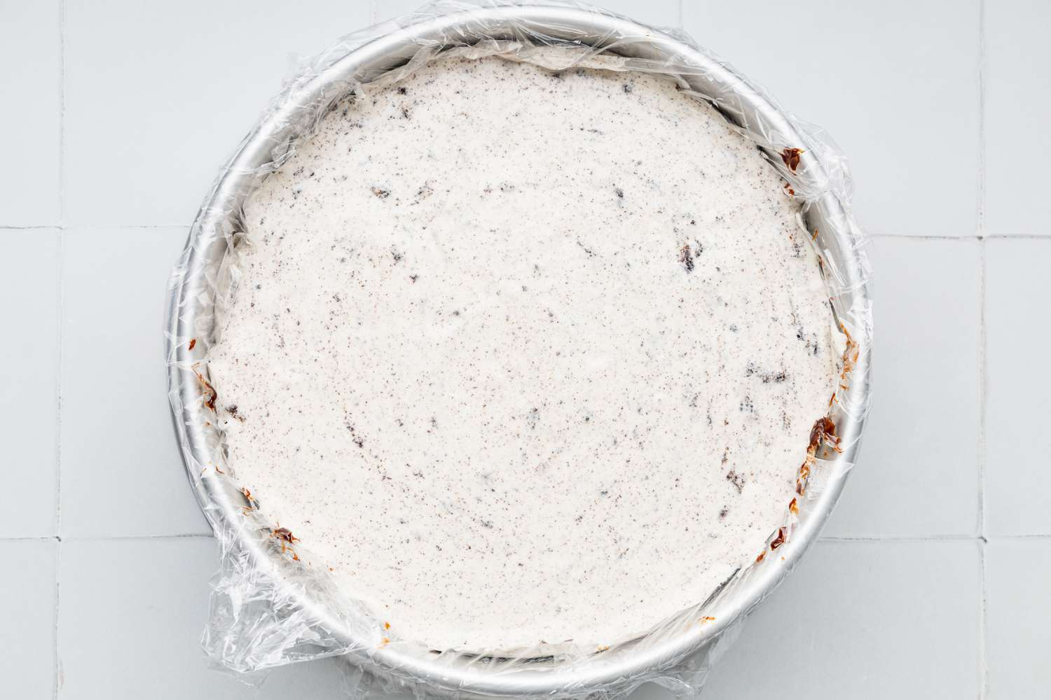 Assembling the Oreo Ice Cream Cake (Rest of the Layers):Cookies & Cream Ice Cream Layer Added on Top of Crunchies