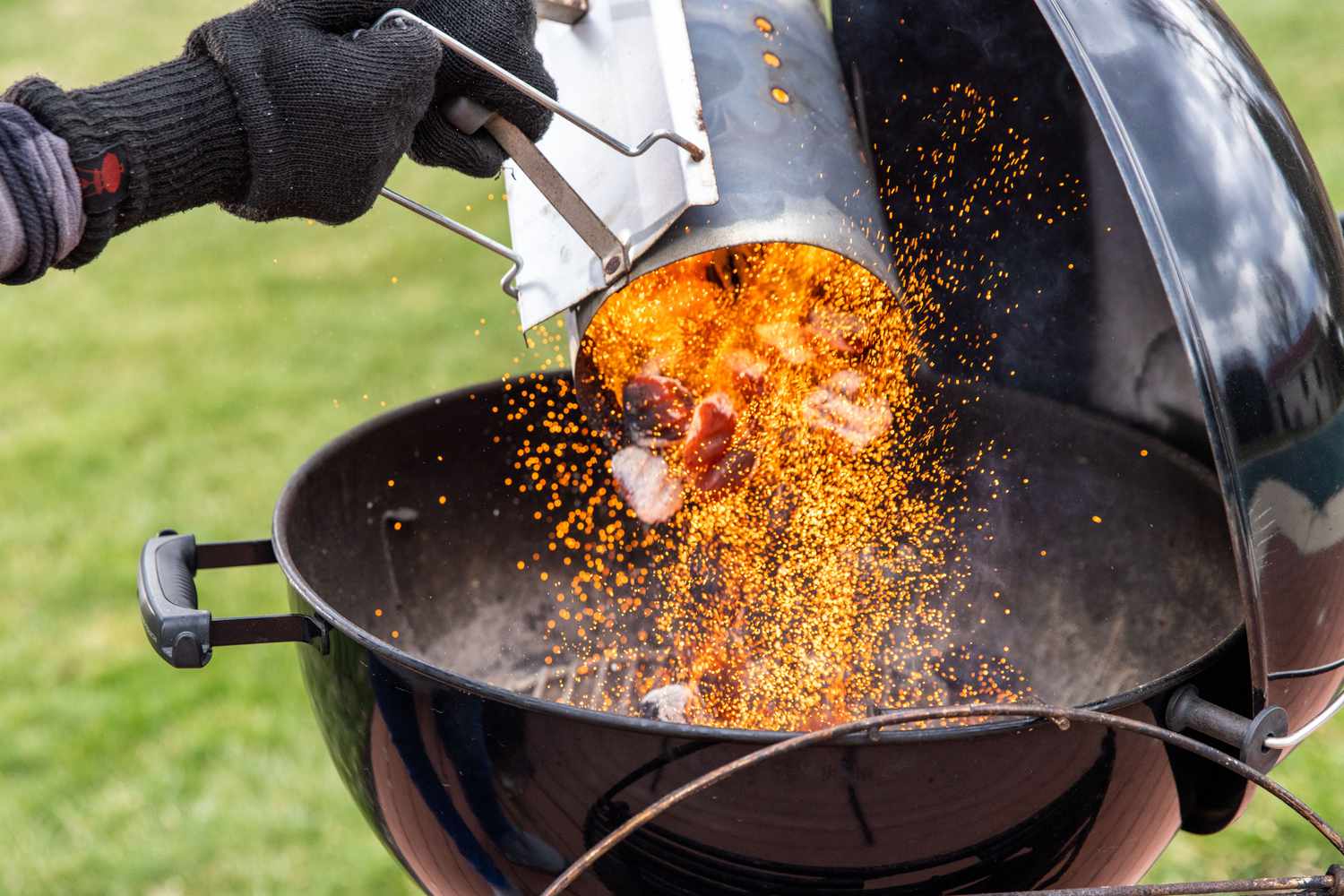 Heated Charcoal Added to Grill 