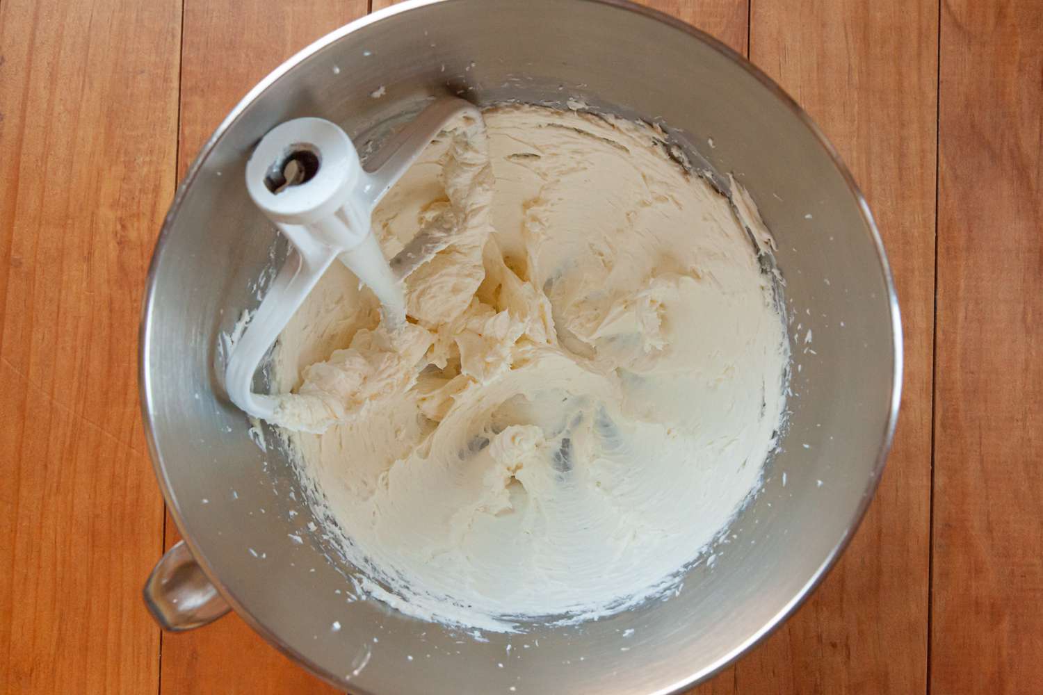 Making the best whipped cream frosting in a stand mixer.