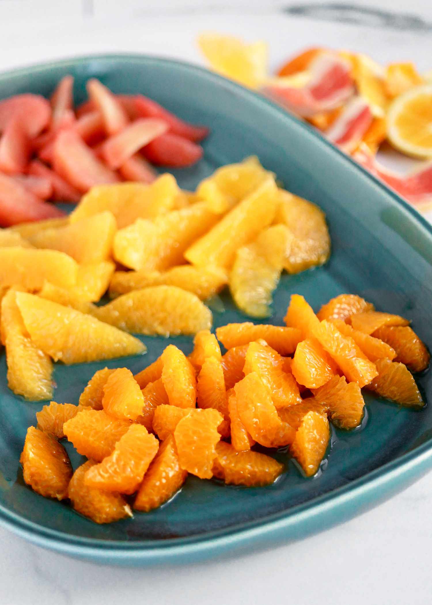 Platter with Three Different Citrus Slices (Front to Back): Clementine, Orange, and Grapefruit for How to Supreme Citrus