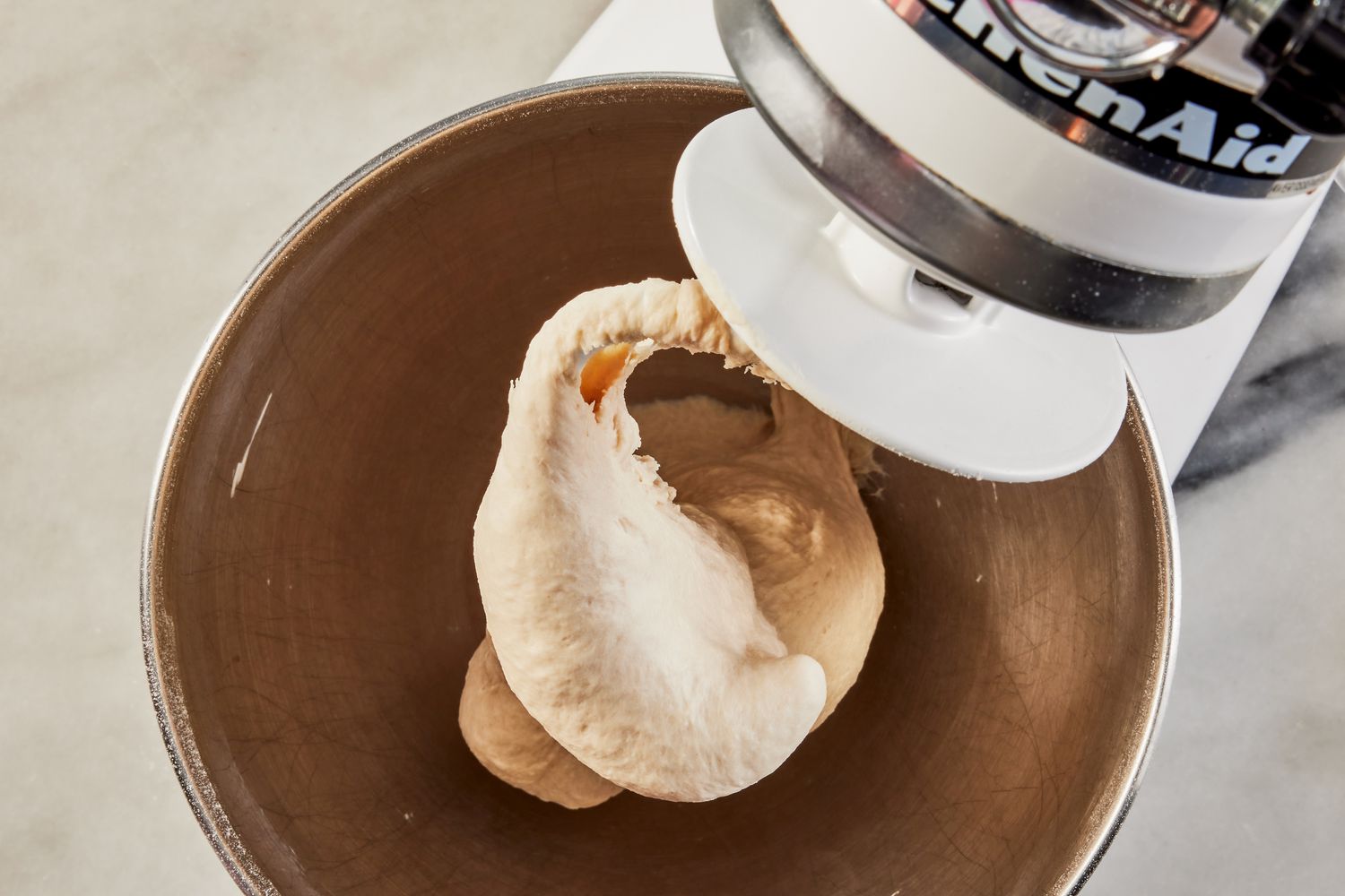 smooth grandma pizza dough in a stand mixer bowl for grandma pizza recipe 