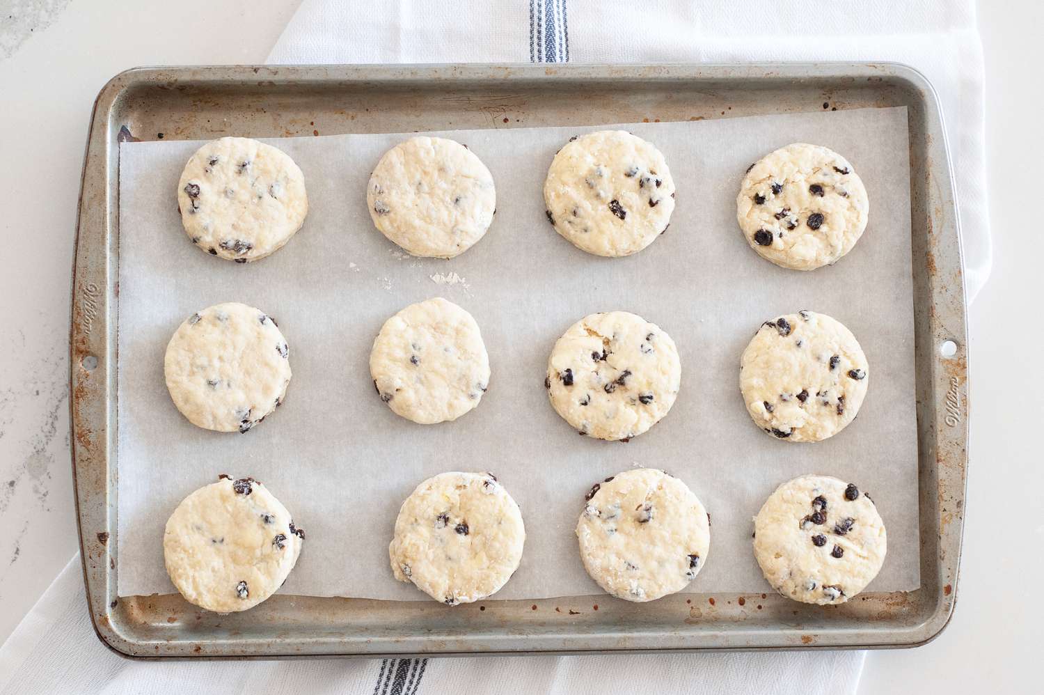 A baking sheet with Irish Scones with Dried Currants ready to bake.