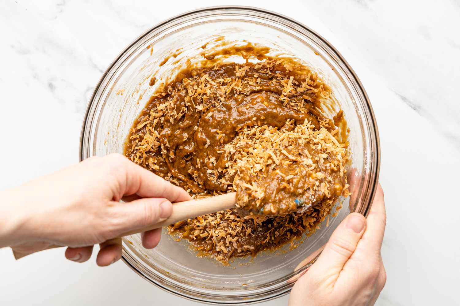 Toasted Coconut Flakes Folded Into Bowl of Banana Mixture 