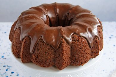 A chocolate bundt cake with glaze on top