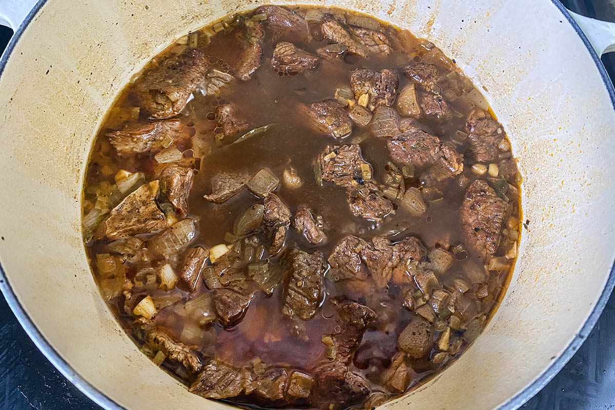 Spicy Beef Stew cooking in a dutch oven.