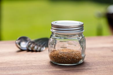 Hamburger Seasoning outside in a glass jar.