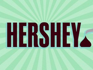 Hersheys logo with stylized chocolate drop against a radial background