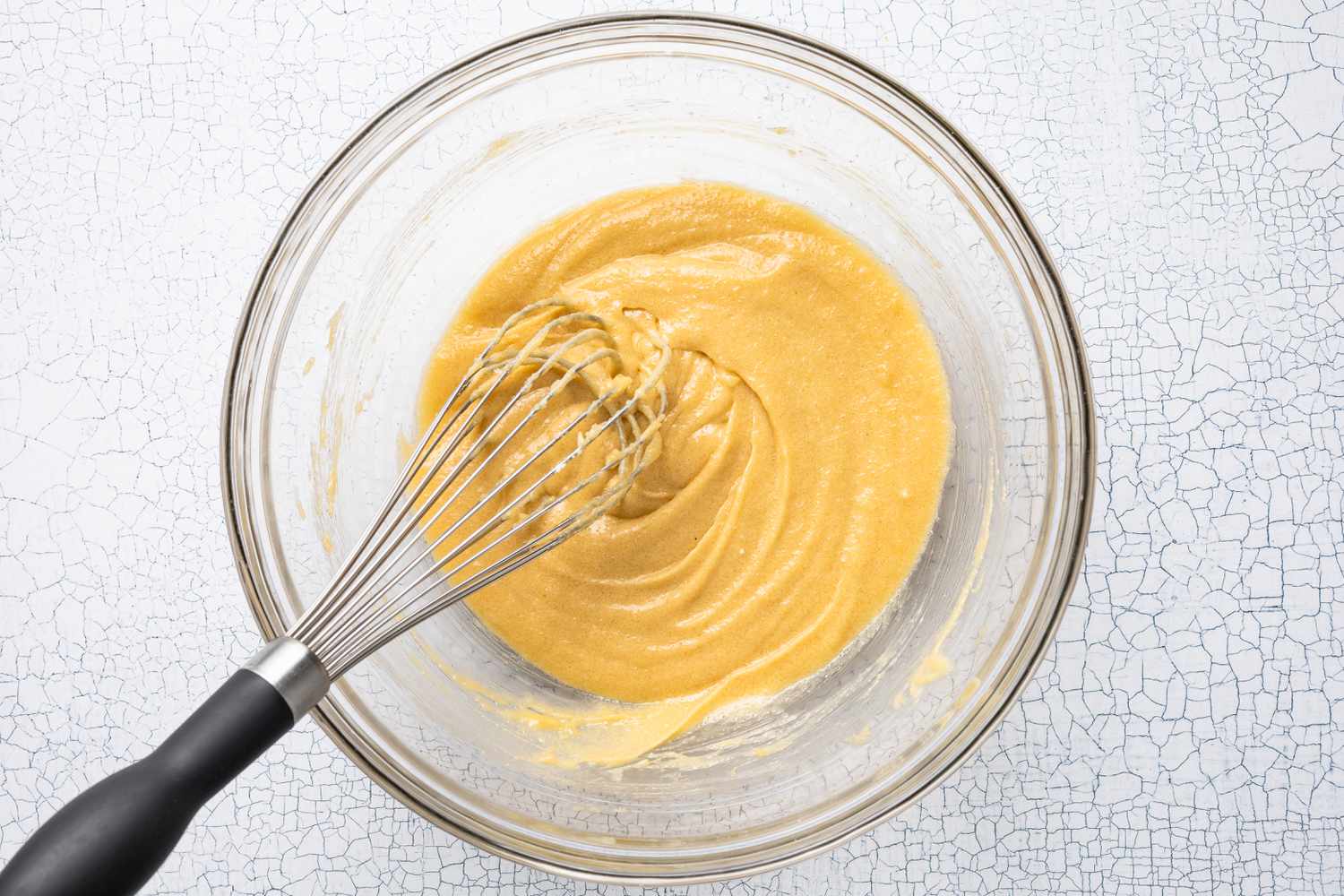 Egg Whisked Into Bowl With Sugar Mixture for Strawberry Cheesecake Cookie Recipe