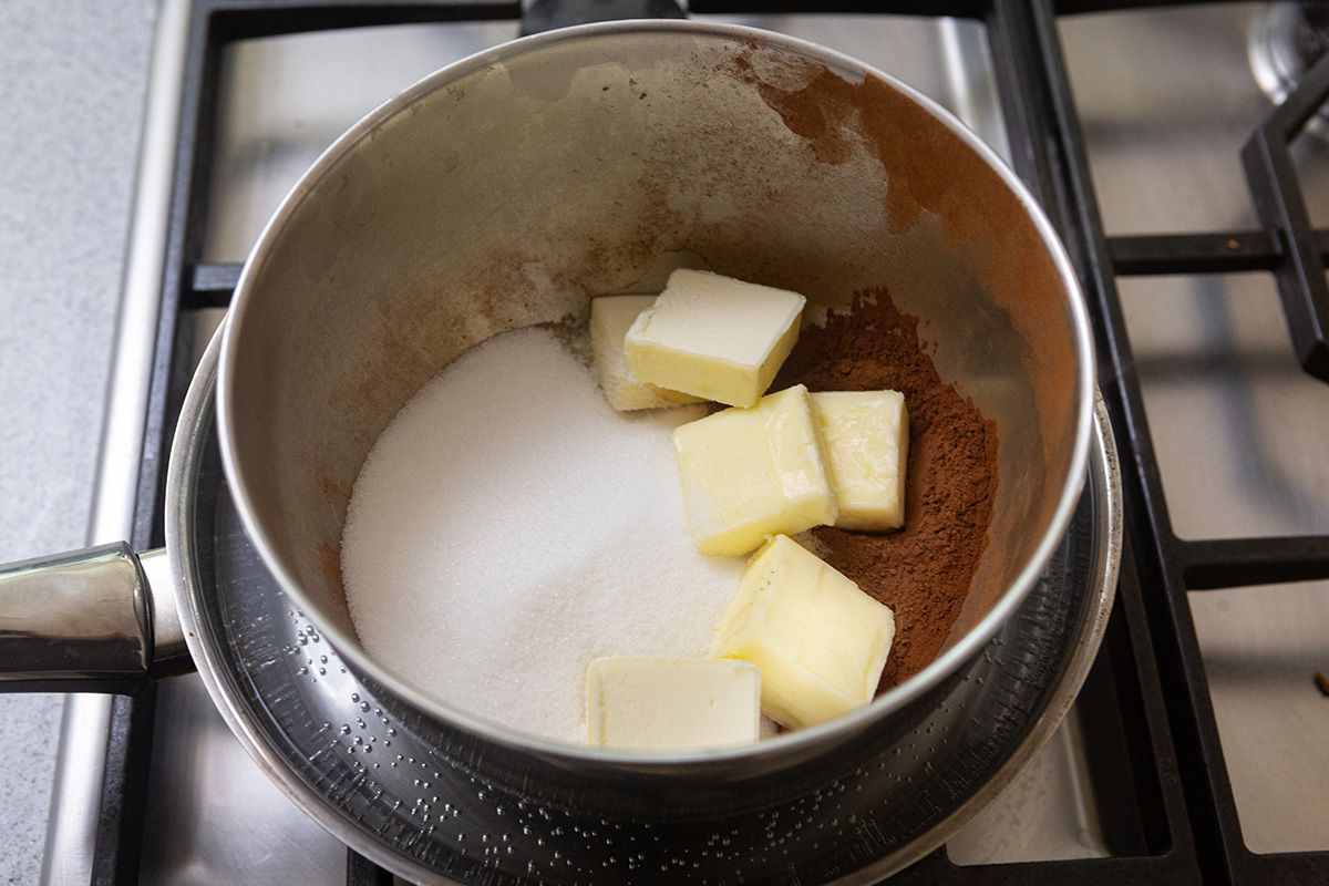 A metal bowl with ingredients to make the best brownie recipe.