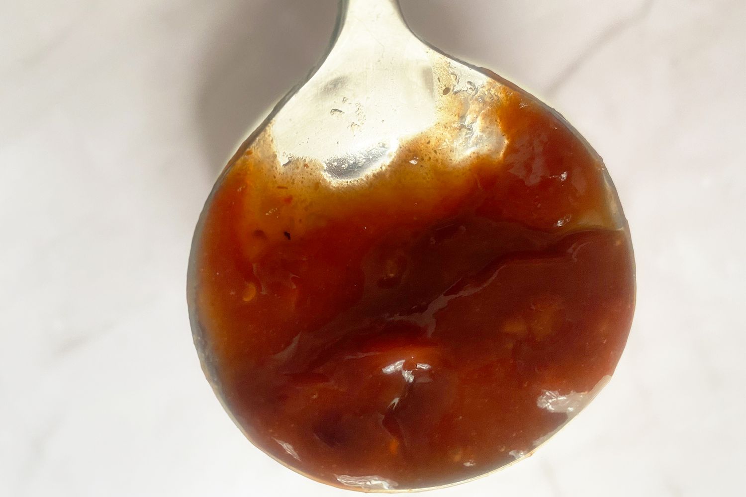 ladle with barbecue sauce
