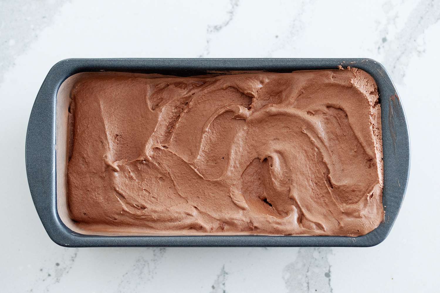 Chocolate ice cream in a loaf pan.