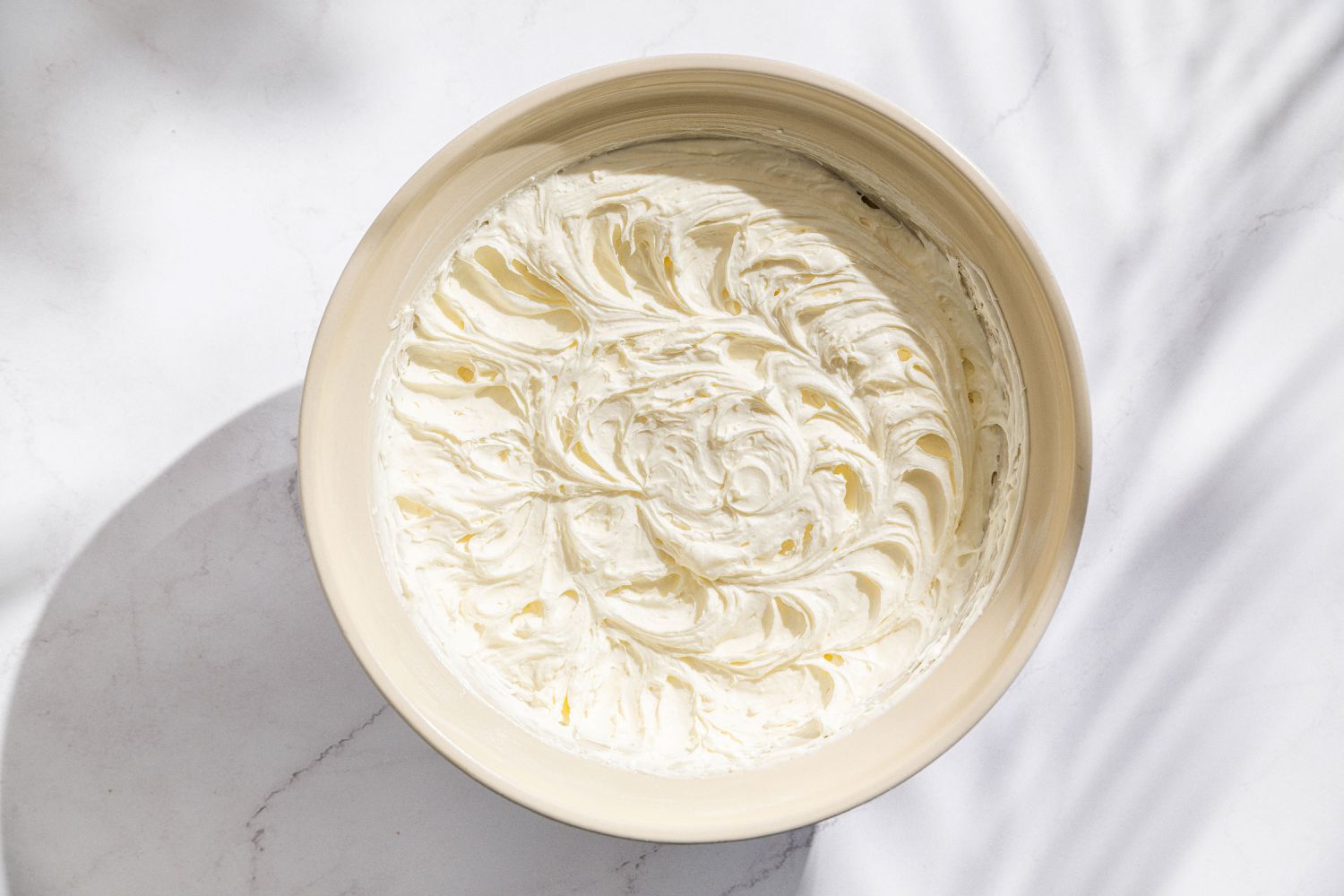large bowl of Chantilly cream for Easy Berry Chantilly Cake