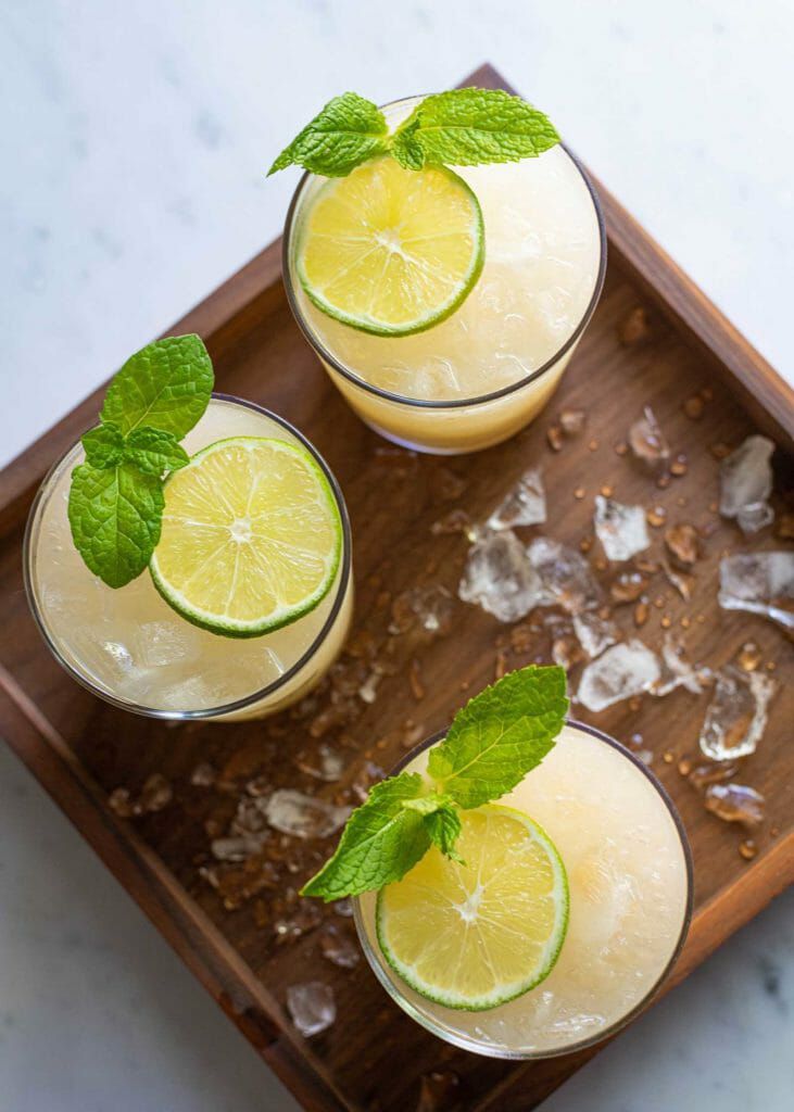 How To Make a Mai Tai - overhead photo of three mai tais with mint garnish