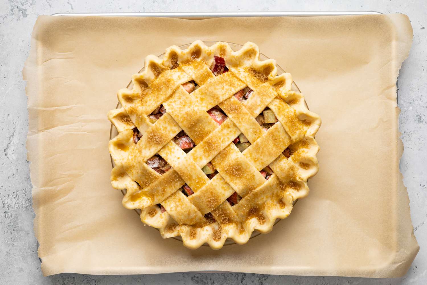 Uncooked Rhubarb Pie on Baking Sheet Lined with Parchment Paper