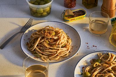 Two plated portions of spaghetti aglio e olio