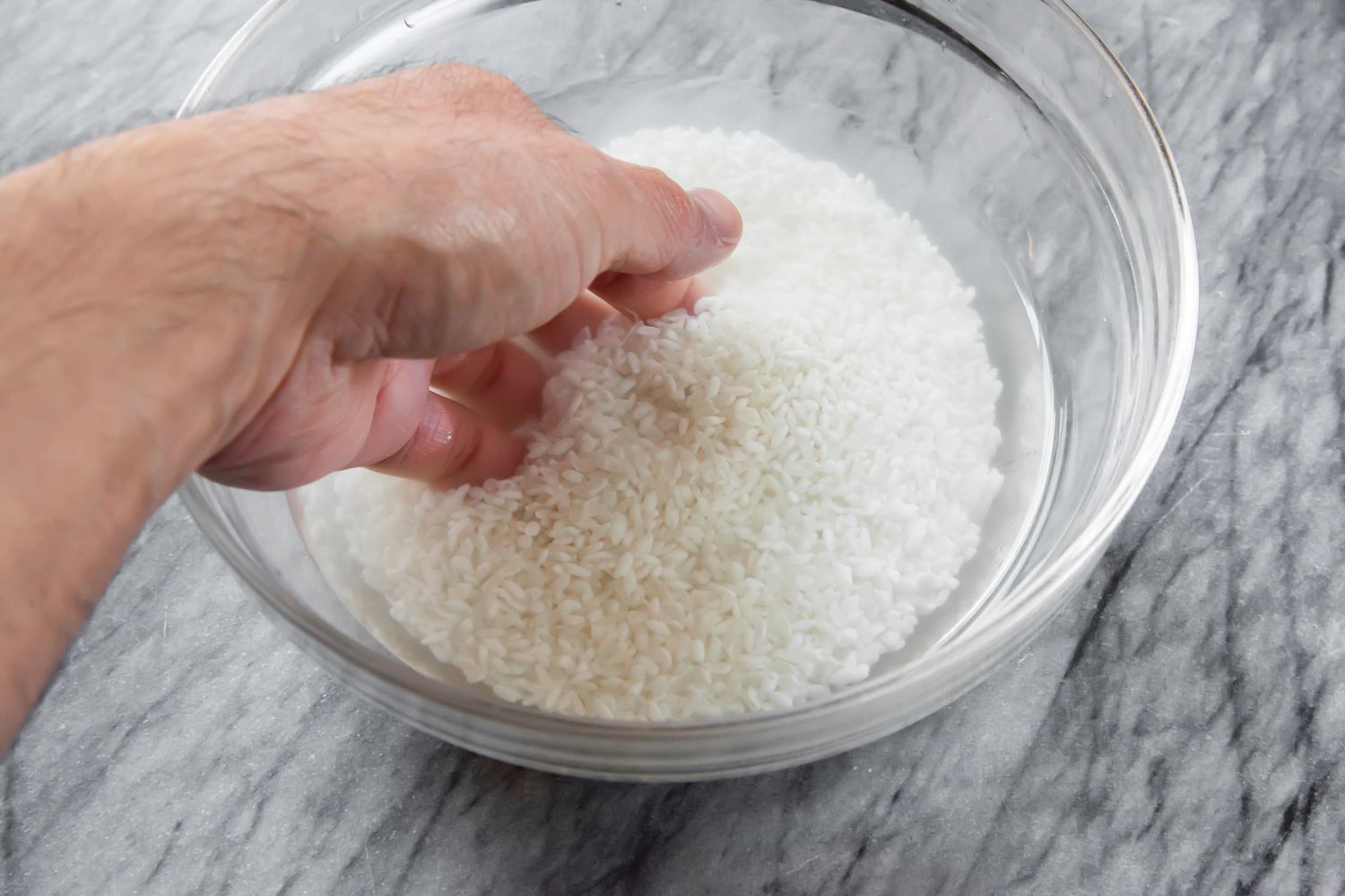 Wash Rice in Bowl of Water 